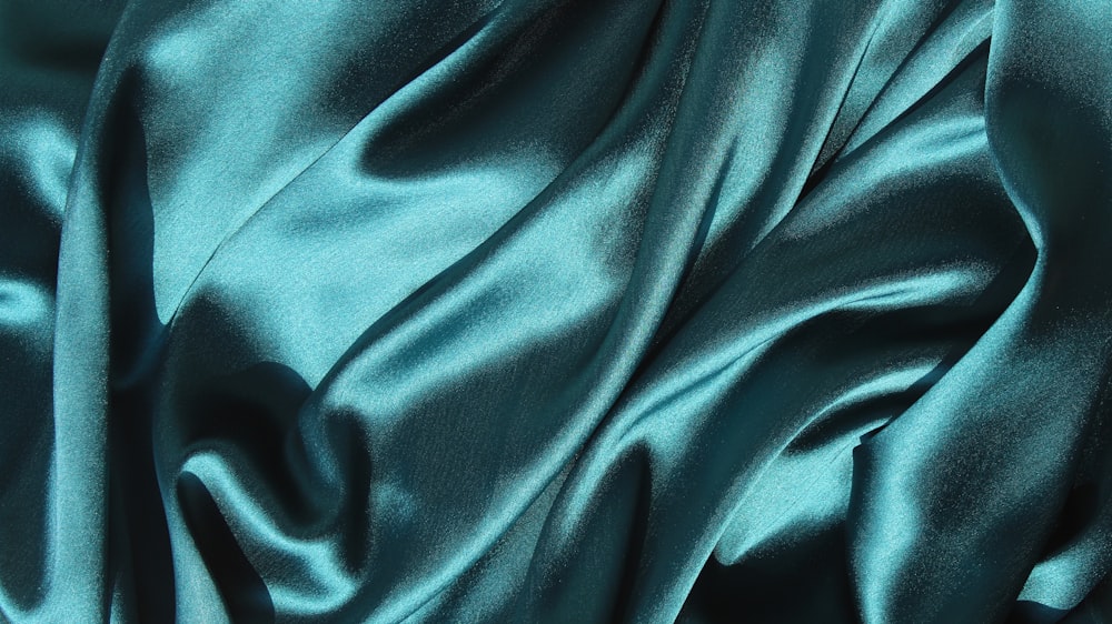 Teal tissue silk catching light in close-up