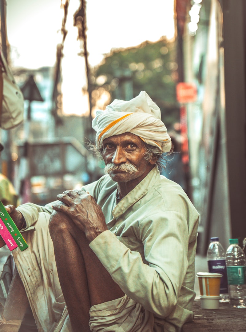 Mohammad Idris Ansari, master weaver, at rest outside the karkhana
